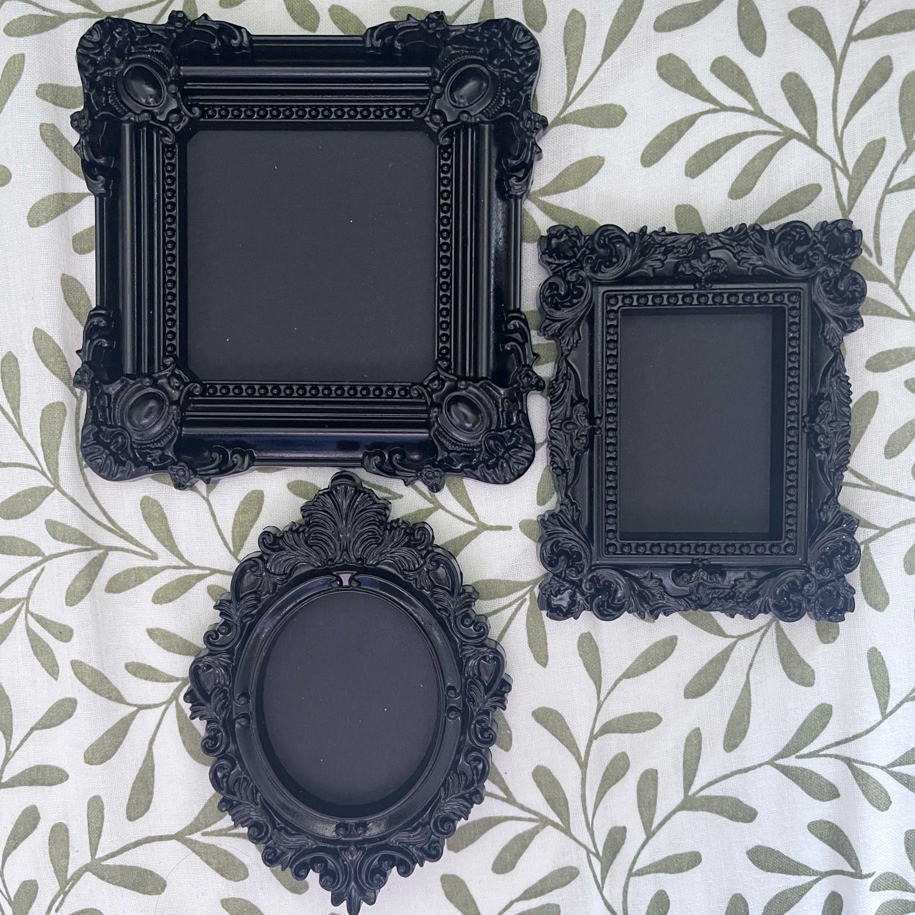 Three black decorative frames on a patterned background.