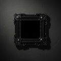 Decorative black picture frame on a dark gray wall