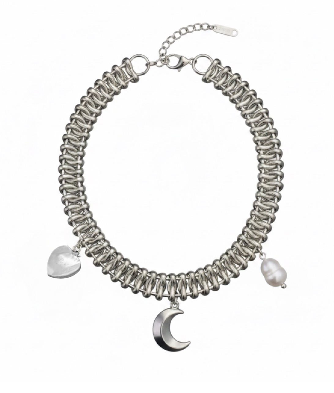 A silver-toned chain necklace with a wide, tightly woven or coiled band, featuring three dangling charms: a translucent white heart, a white irregular pearl-like bead, and a polished silver crescent moon.