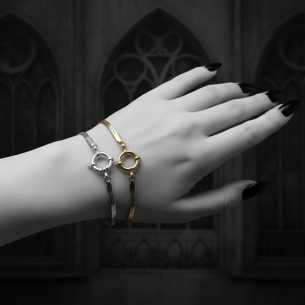 Hand wearing two bracelets with a dark, decorative background
