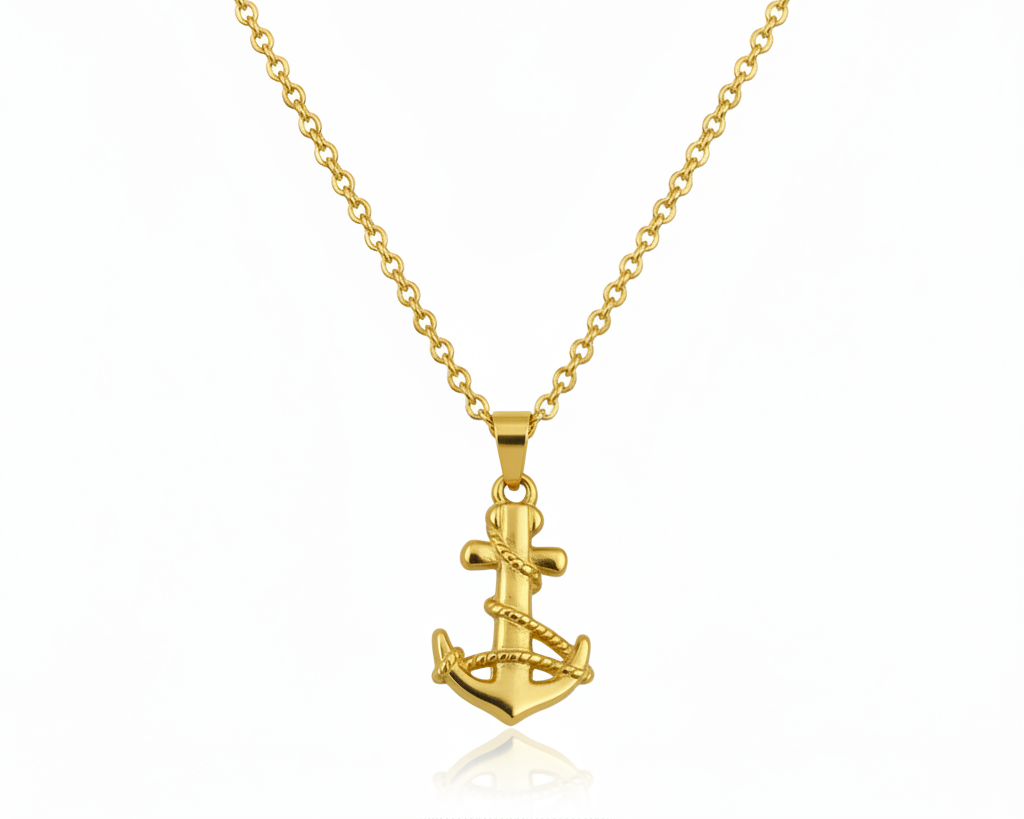 Gold anchor necklace on a white background.