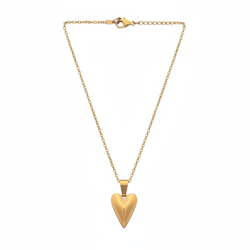 Gold necklace with a heart-shaped pendant on a white background