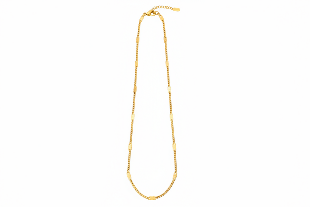 Gold chain necklace on a white background
