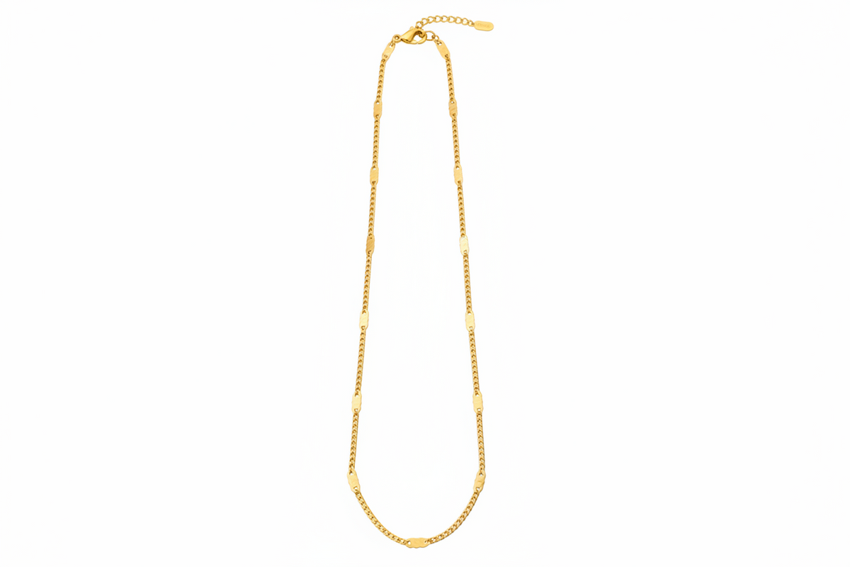 Gold chain necklace on a white background