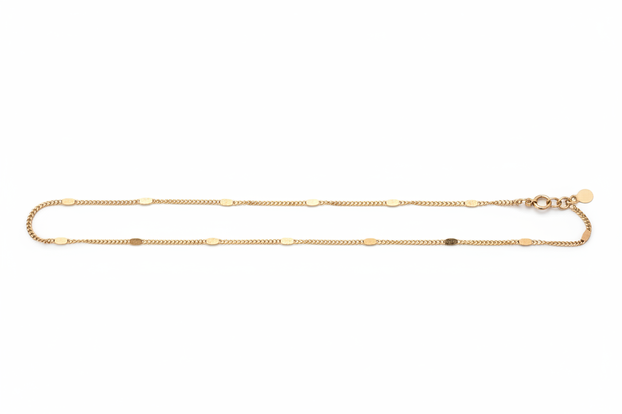 Gold chain necklace on a white background