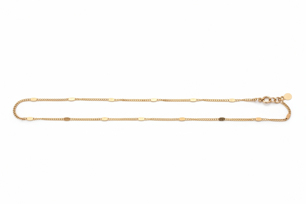 Gold chain necklace on a white background