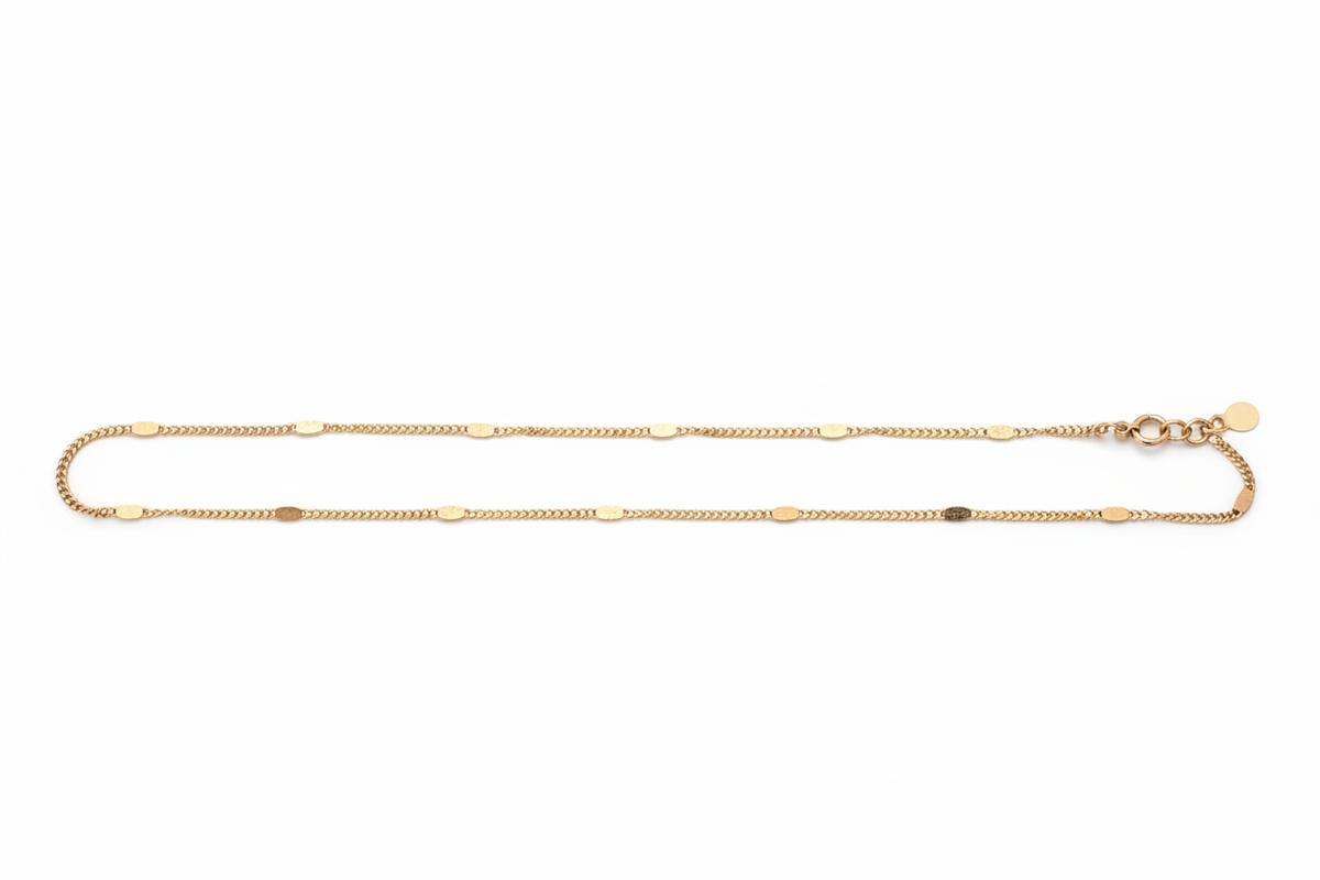 Gold chain necklace on a white background