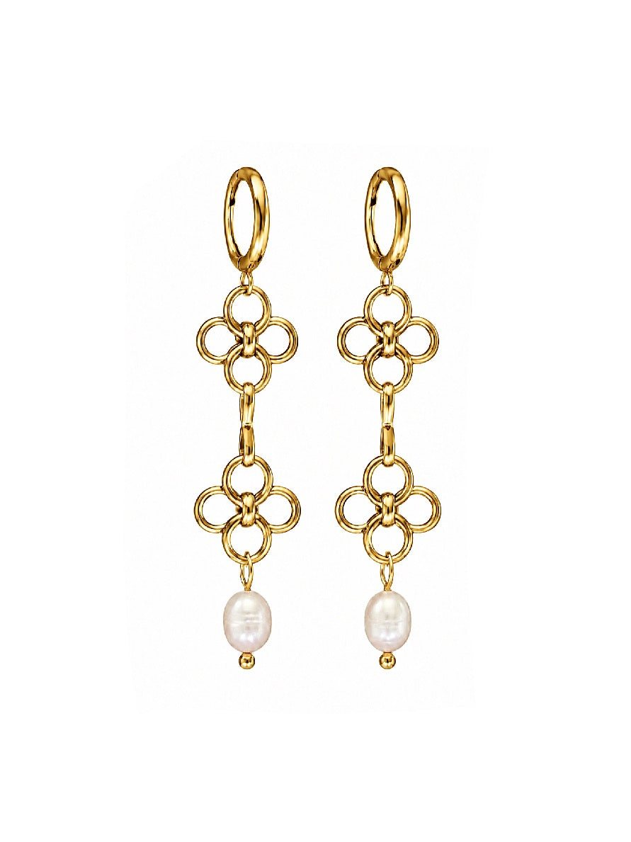 A pair of gold dangle earrings with a quatrefoil link design and a small white pearl drop, shown on a plain white background.