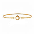 Gold bracelet with a clasp on a white background