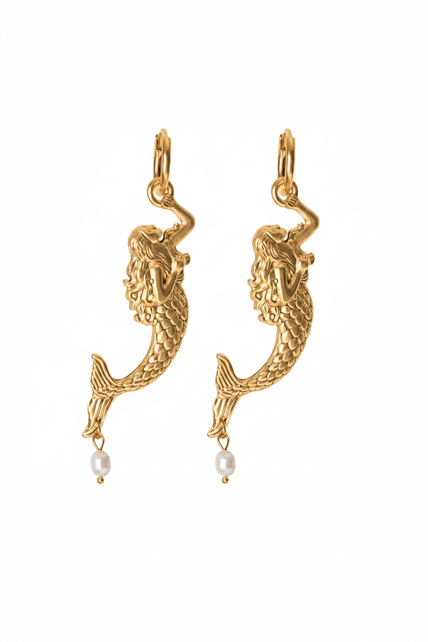 A pair of gold-tone mermaid dangle earrings with a small white pearl hanging from each earring, shown against a plain white background.