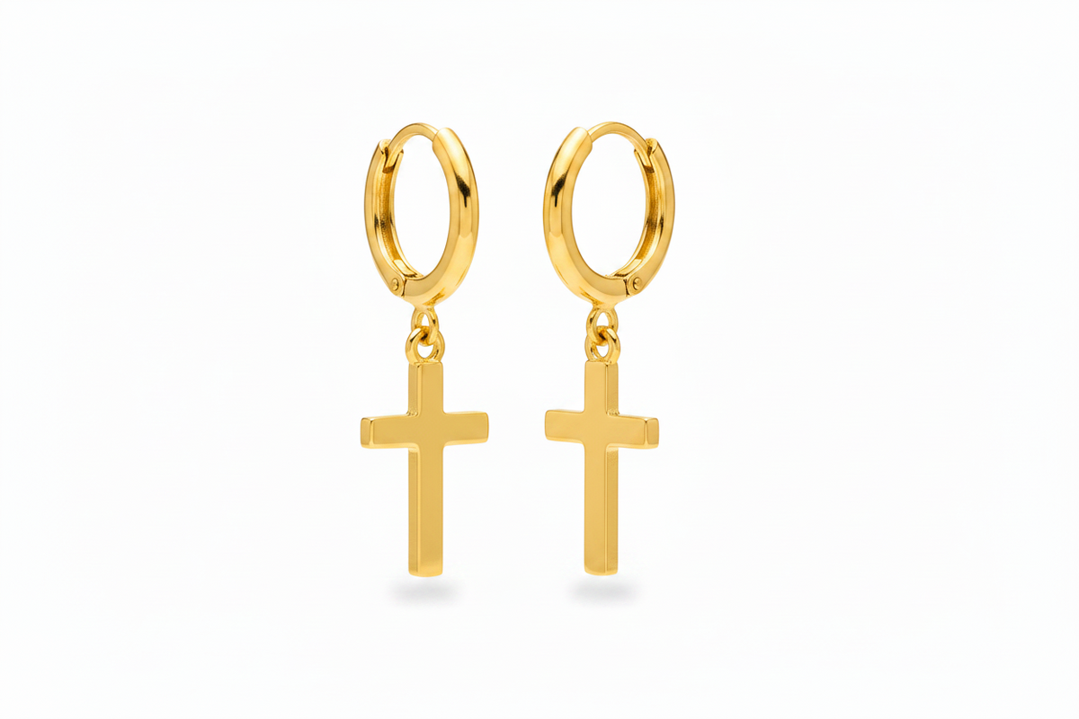 A pair of gold hoop earrings with small cross dangles, shown on a clean white background.
