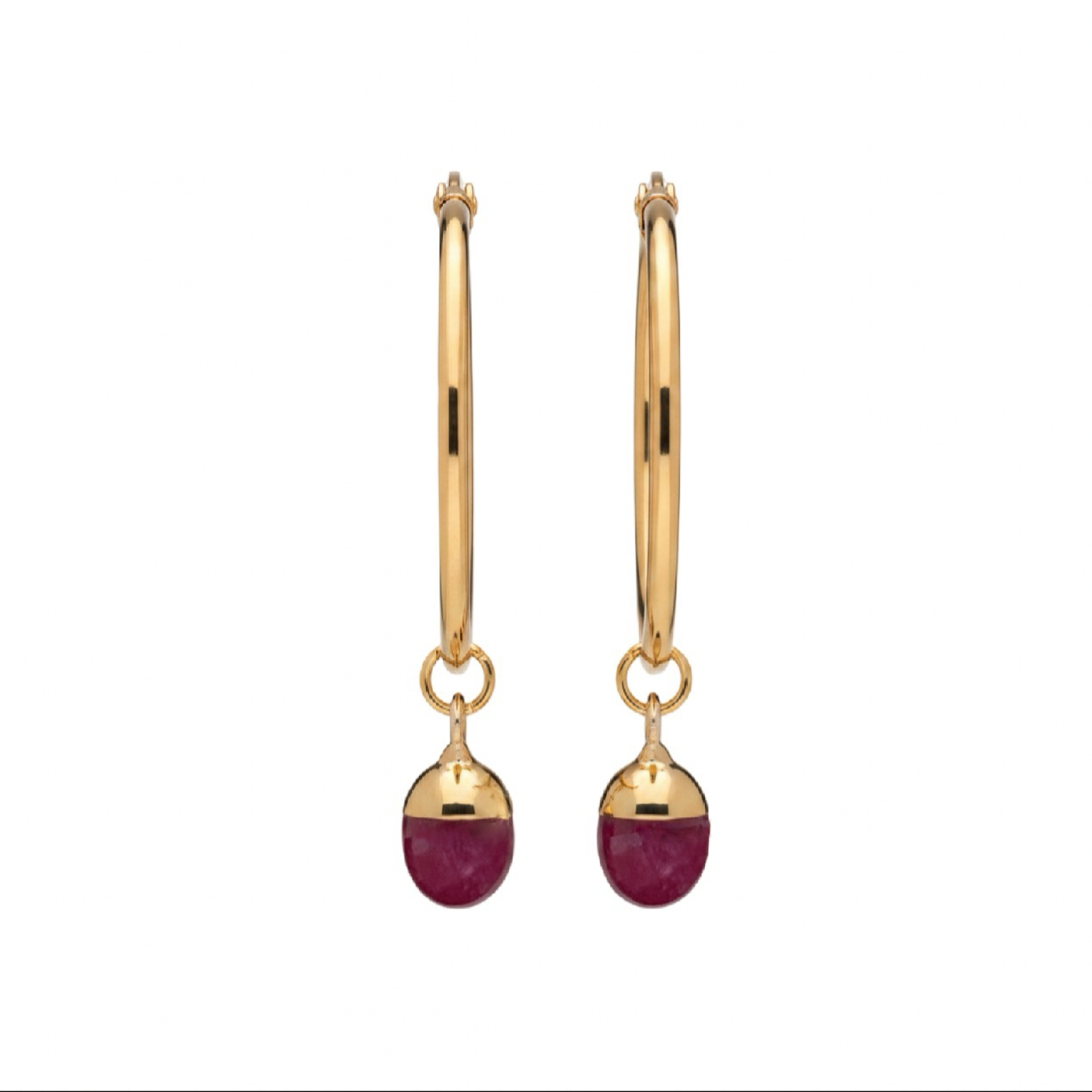 A pair of gold  hoop earrings with a deep pink gemstone, shown against a plain white background.