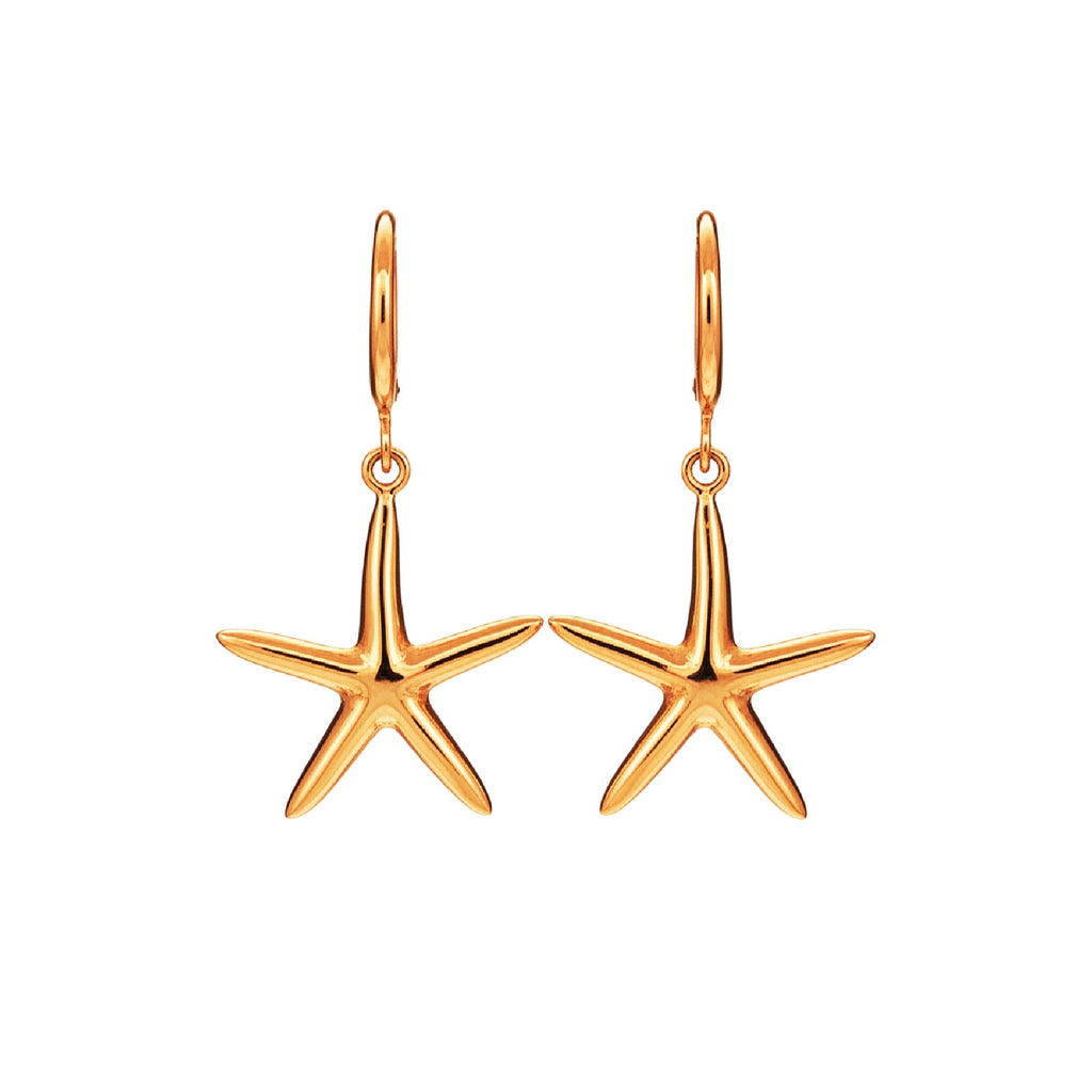 Gold starfish earrings on a white background