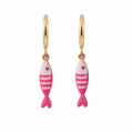 Gold hoop earrings with pink fish-shaped charms on a white background