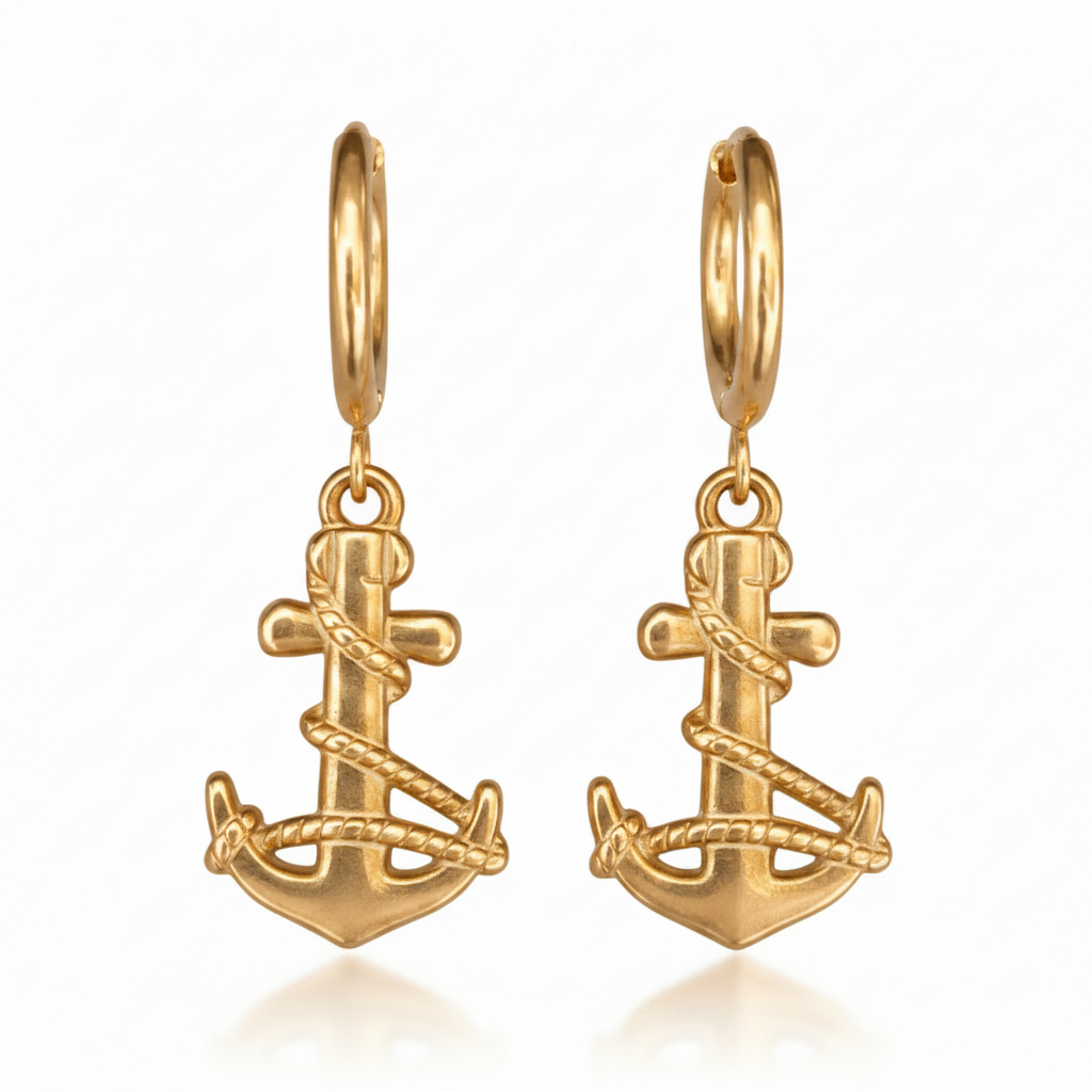 Gold anchor-shaped earrings on a white background