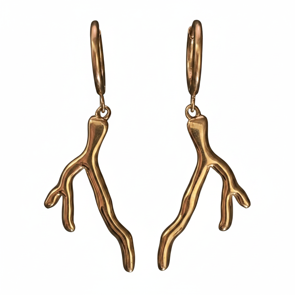 Pair of gold coral-shaped earrings on a white background