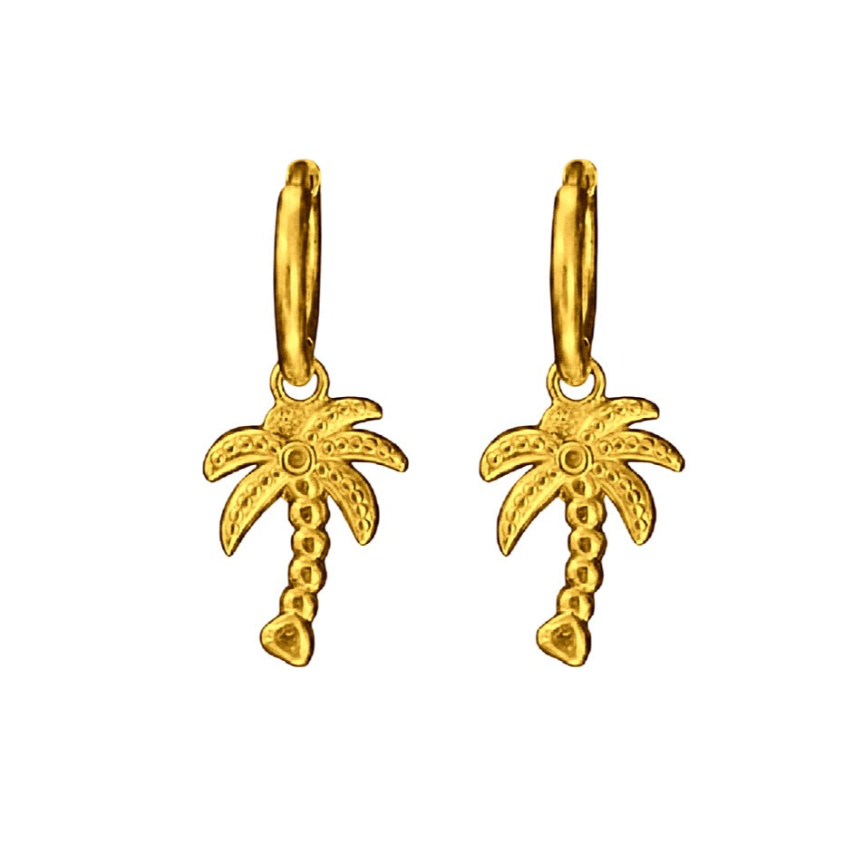 Gold palm tree earrings on a white background