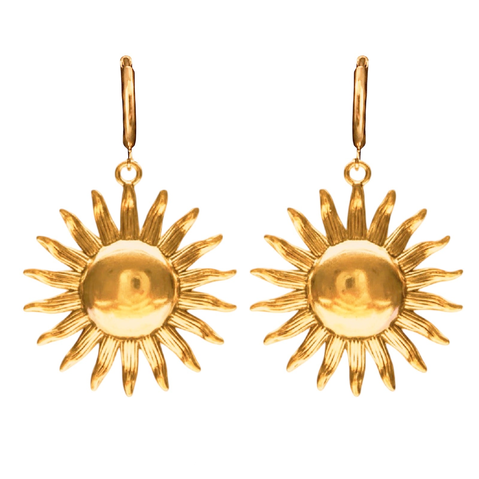 Gold sun-shaped earrings on a white background