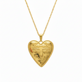 Gold heart-shaped pendant necklace on a white background