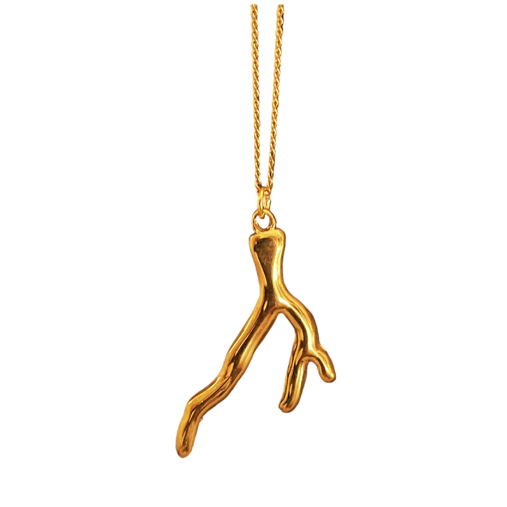 Gold coral-shaped pendant on a chain against a white background