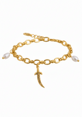 A gold chain bracelet featuring a central crescent moon pendant with engraved details, accented by two white pearl beads at the ends, shown on a plain white background.