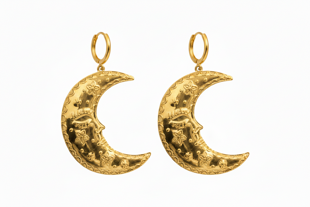Gold crescent moon earrings on a white background