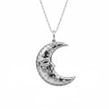 Large silver crescent moon pendant with face detail