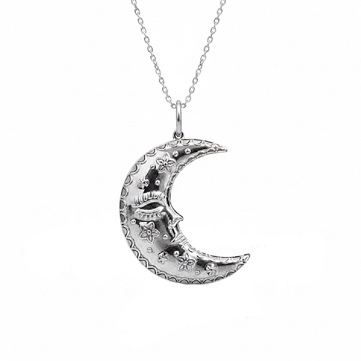 Large silver crescent moon pendant with face detail
