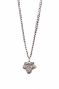 A silver-toned necklace featuring a textured, leaf-shaped pendant suspended from a curb chain, shown against a plain white background.