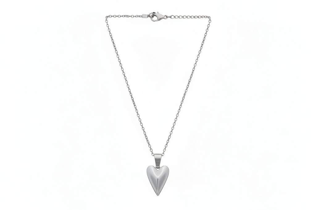 Silver heart-shaped pendant on a chain against a white background