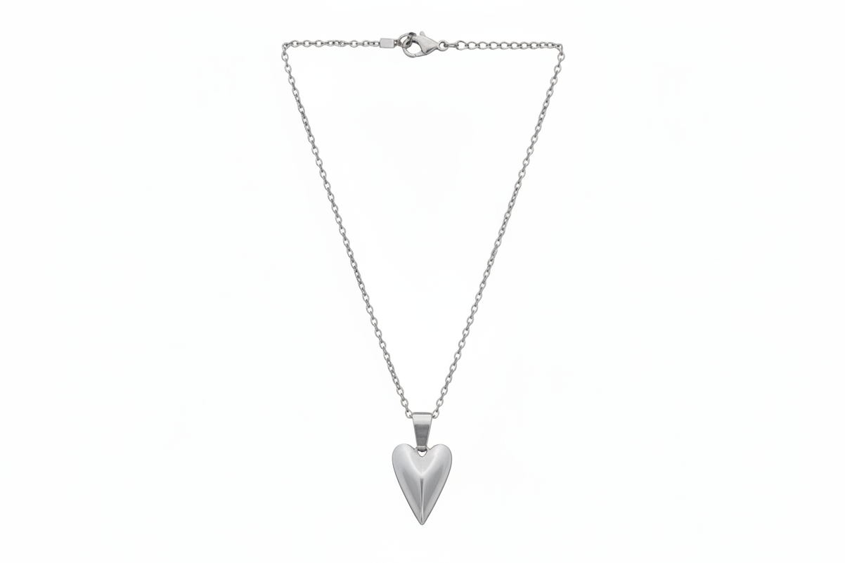 Silver heart-shaped pendant on a chain against a white background