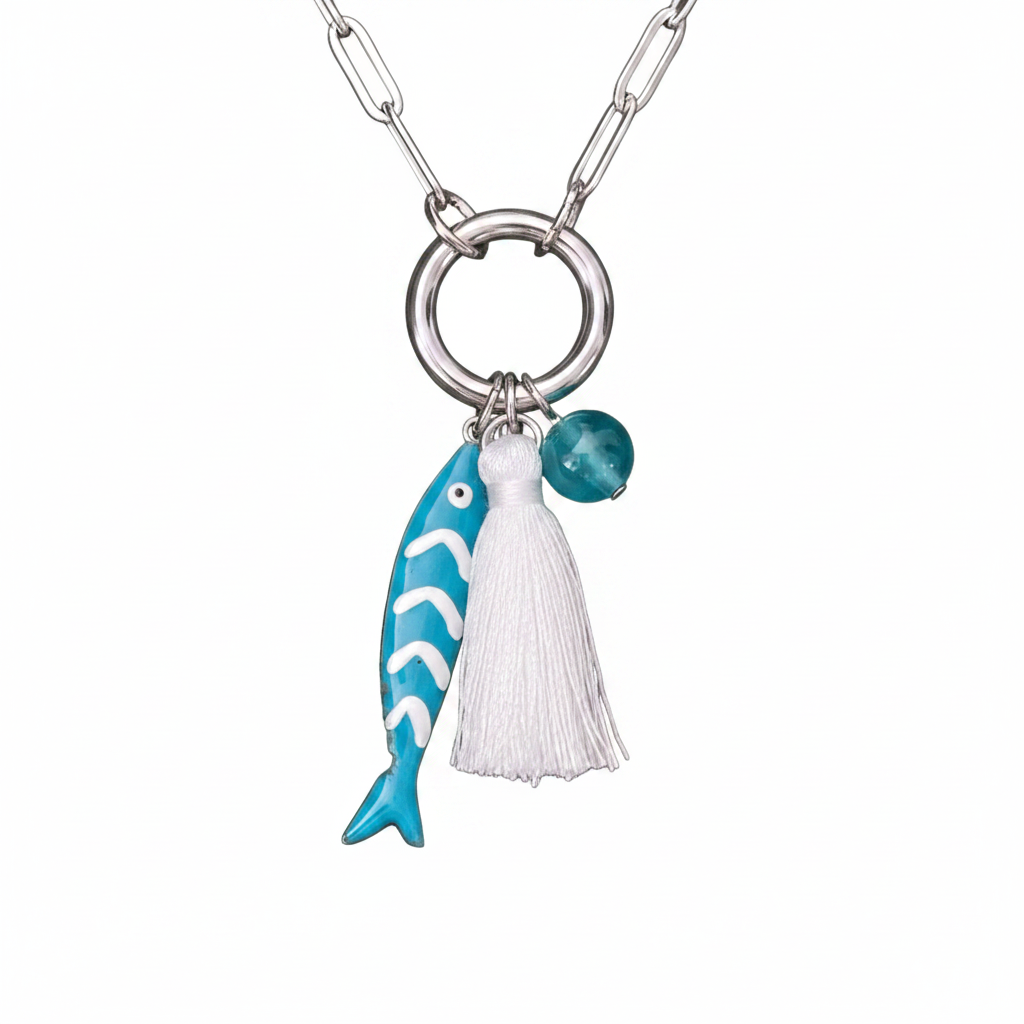 Necklace with a turquoise fish pendant, white tassel, and turquoise bead on a white background