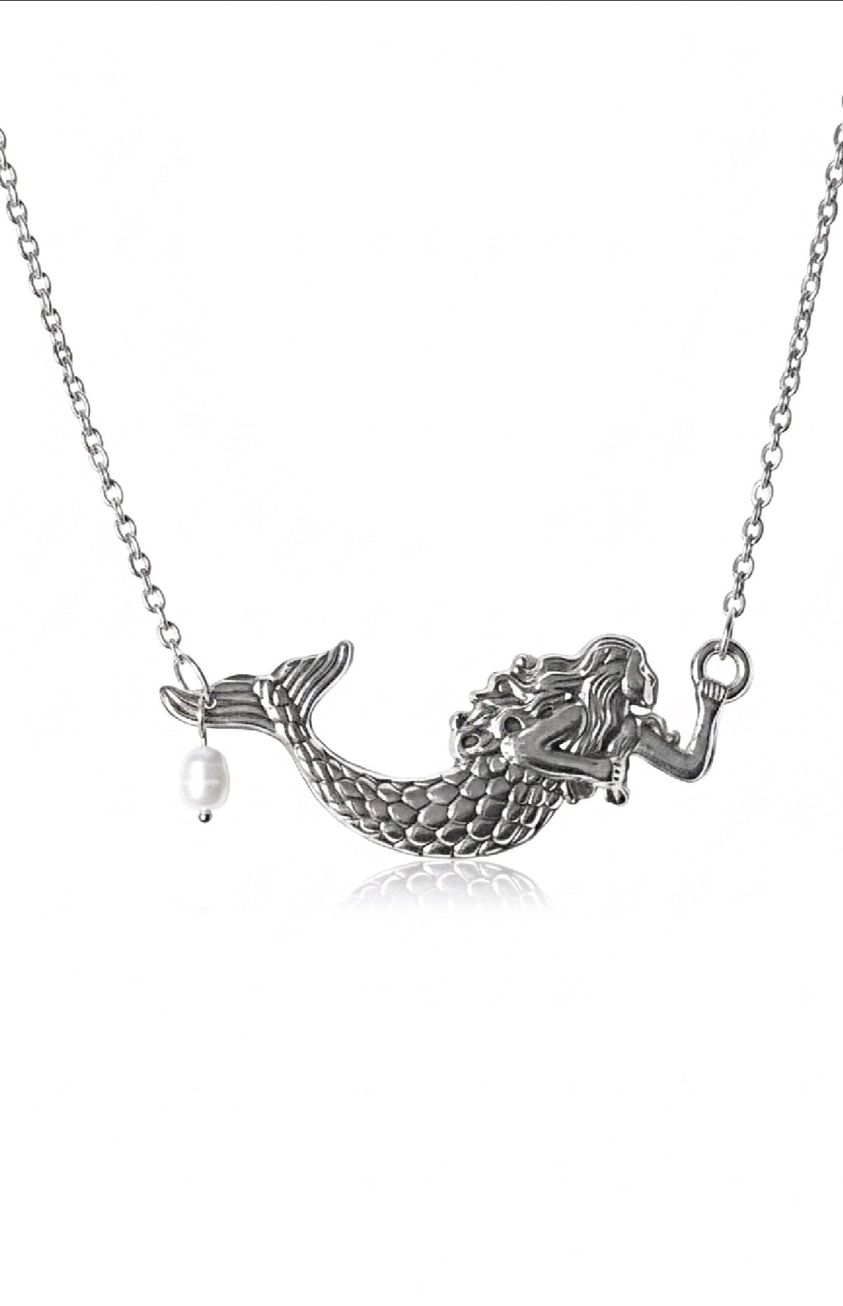 Silver mermaid necklace with a detailed mermaid figure on a chain, featuring a small dangling white pearl, shown against a plain white background.