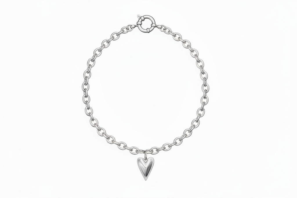 Silver chain bracelet with a heart-shaped charm on a white background