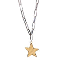 Gold star pendant on a silver chain against a white background