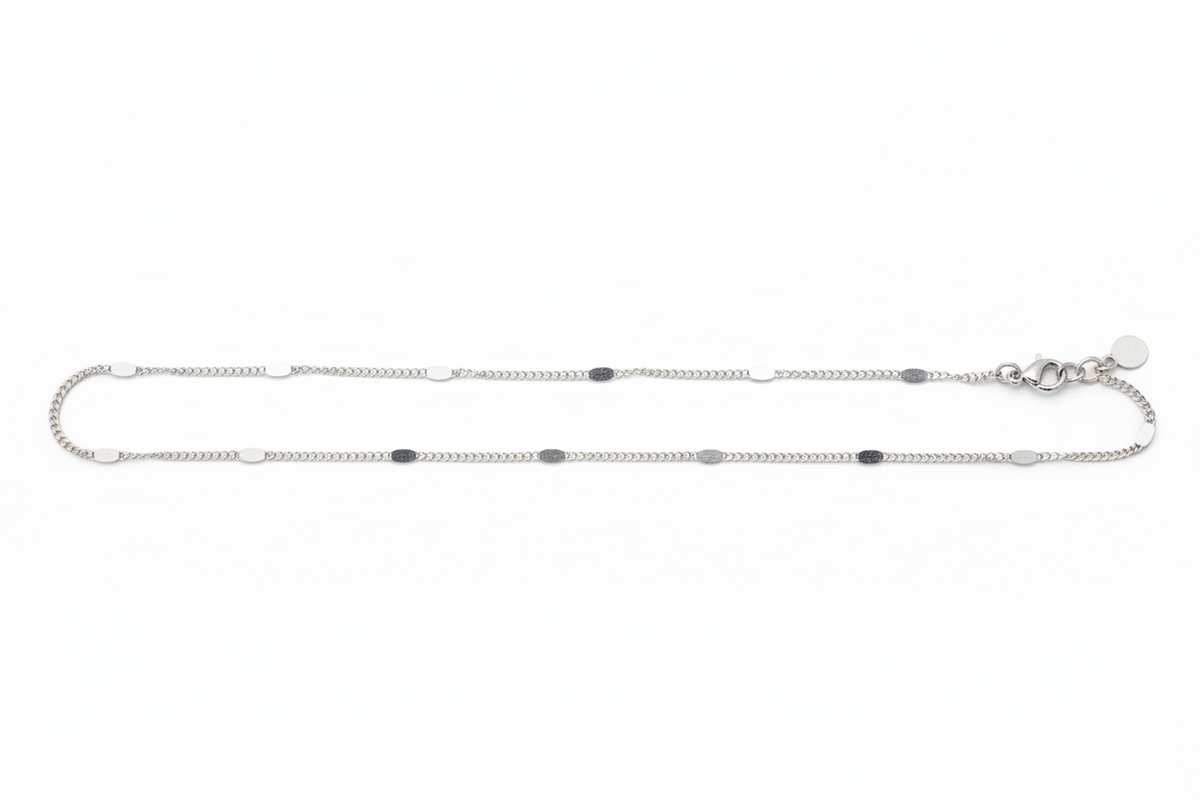 Silver chain necklace on a white background