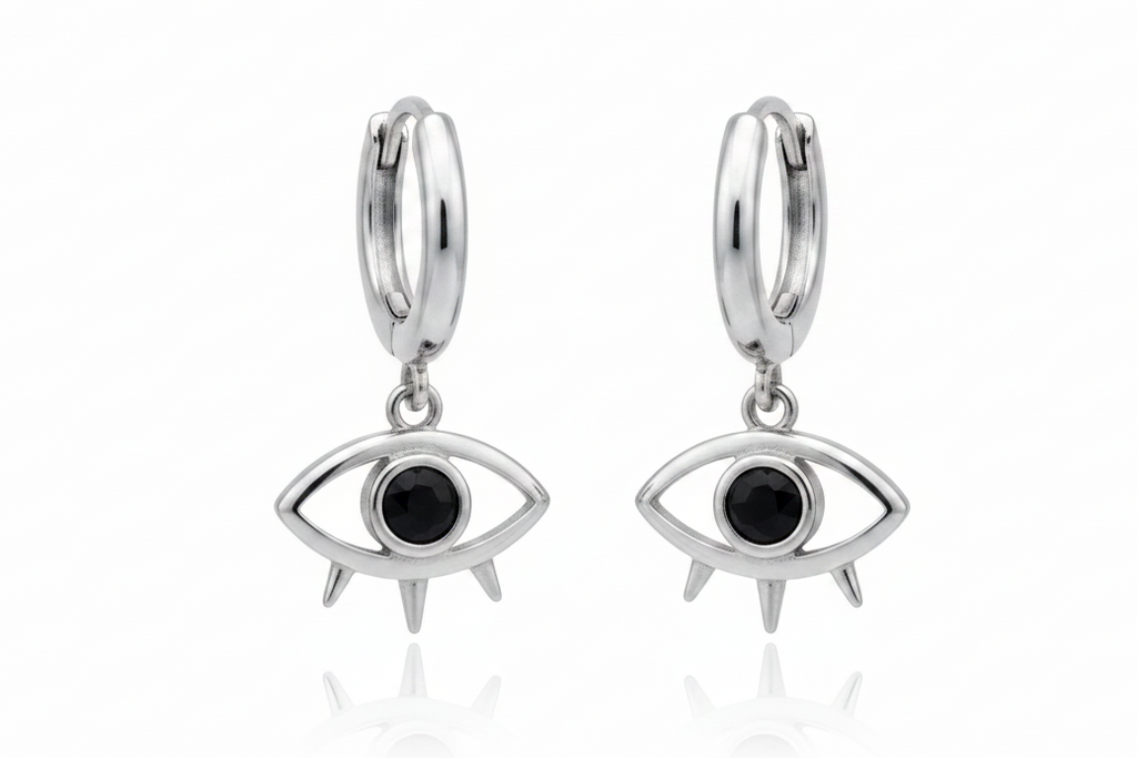 Silver hoop earrings with eye-shaped charms on a white background