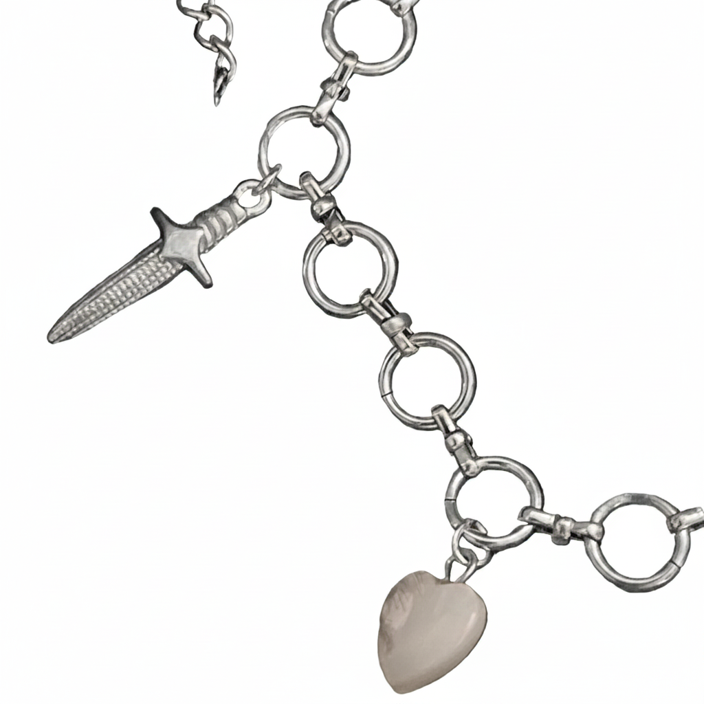 Silver bracelet with dagger and heart charm on a white background