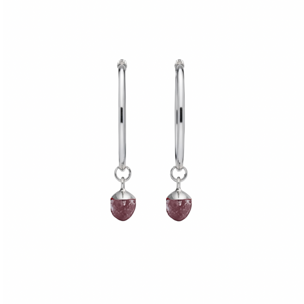 A pair of silver hoop earrings with small faceted amethyst crystal at the bottom, shown on a plain white background.