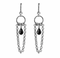 A pair of silver-toned dangle earrings with circular rings, short chain links, and a small teardrop-shaped black stone hanging at the center, shown on a plain white background.