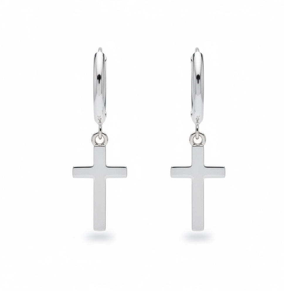 Silver hoop earrings with a small silver cross on a white background.