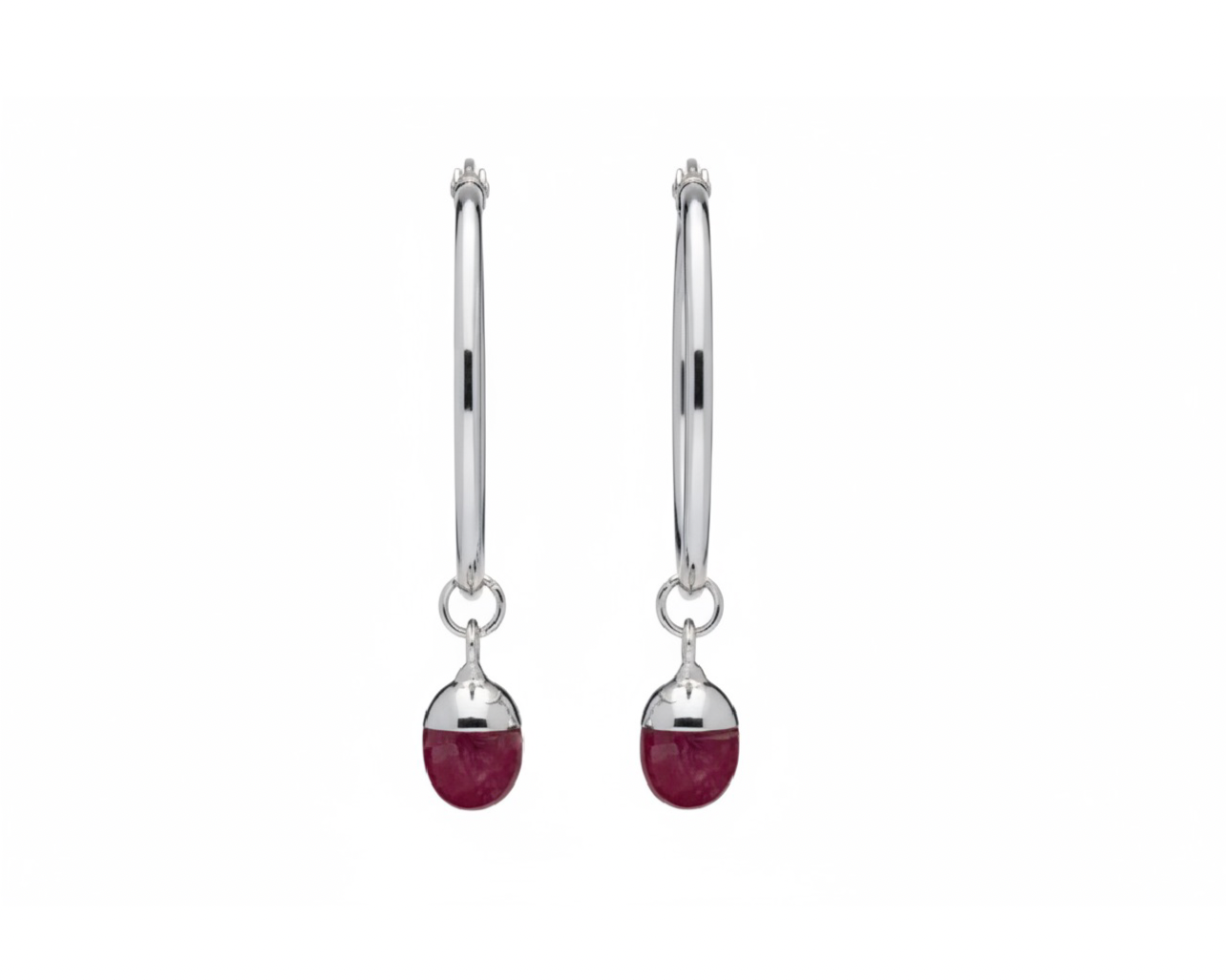 Pair of silver hoops with a pink oval-shaped crystal on a white background