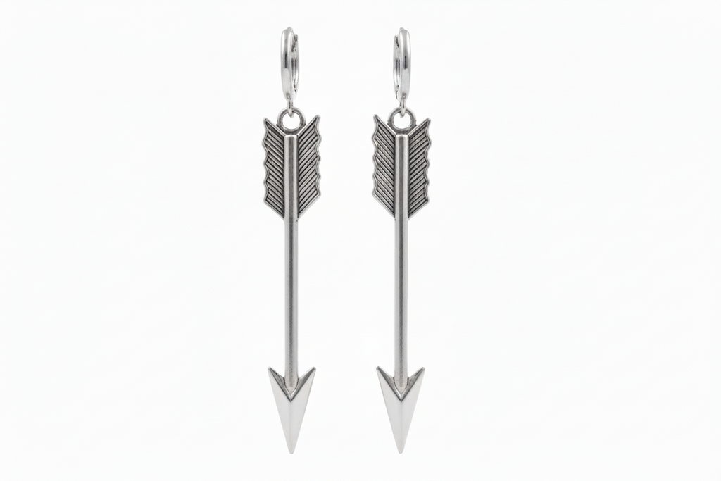 Pair of silver arrow-shaped earrings on a white background