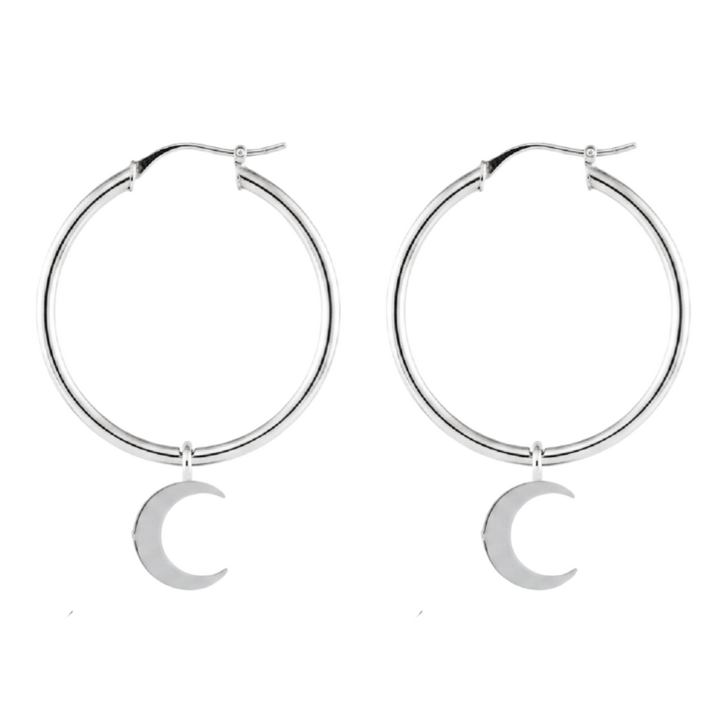 Silver hoop earrings with crescent moon charms on a white background