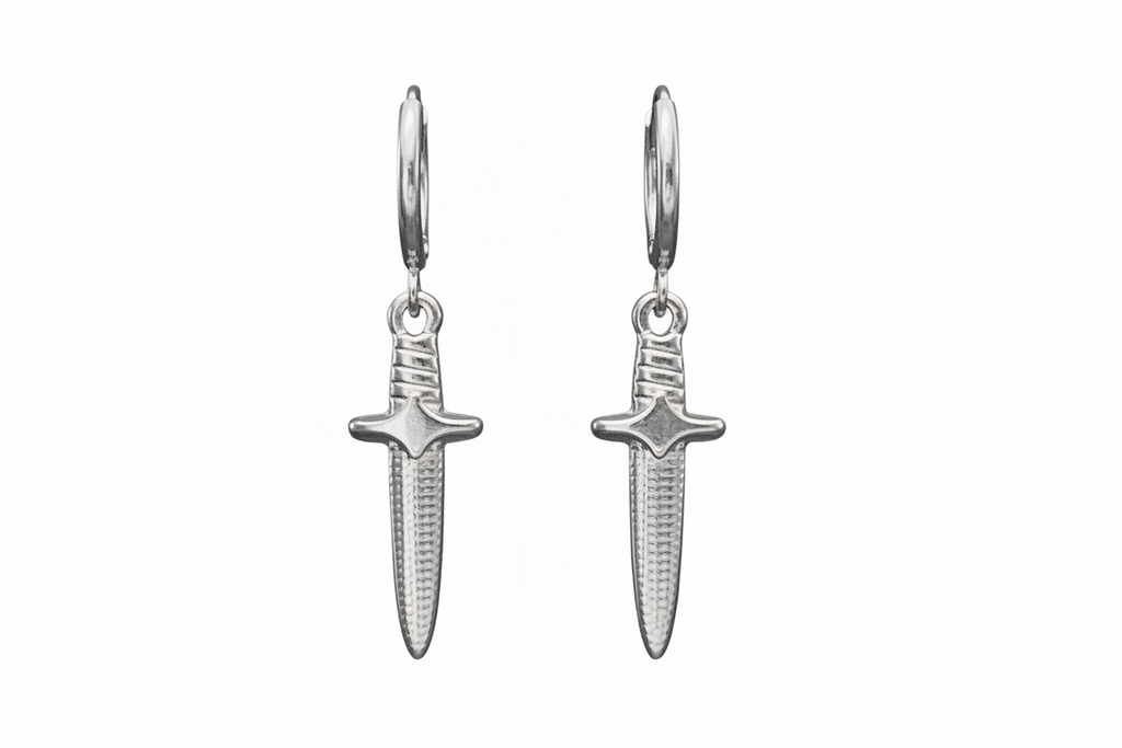 Pair of silver dagger-shaped earrings on a white background