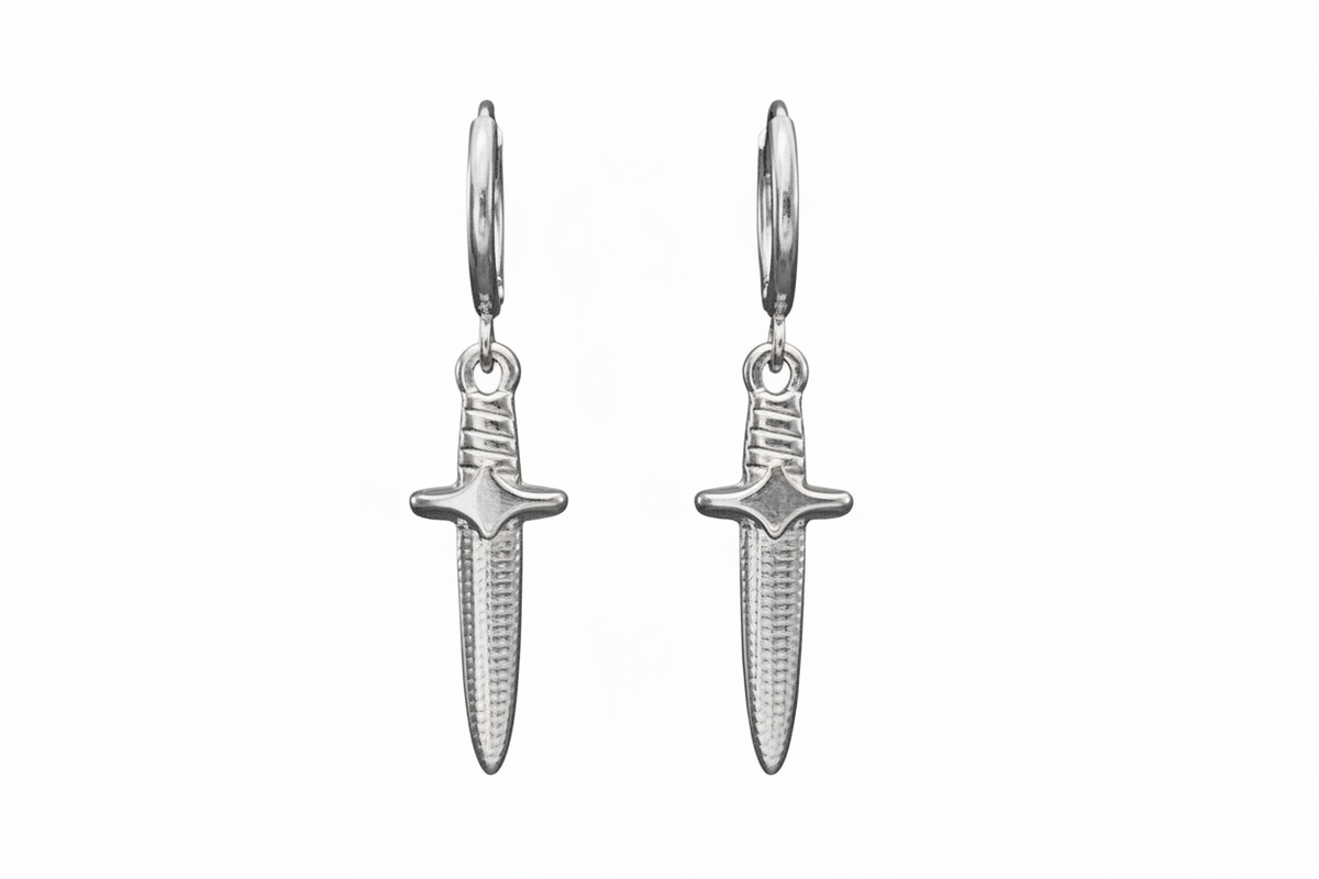 Pair of silver dagger-shaped earrings on a white background