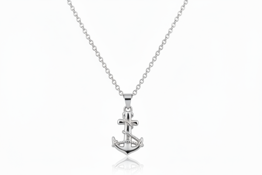Silver anchor pendant necklace on a white background
