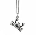 Silver crab pendant on a chain against a white background