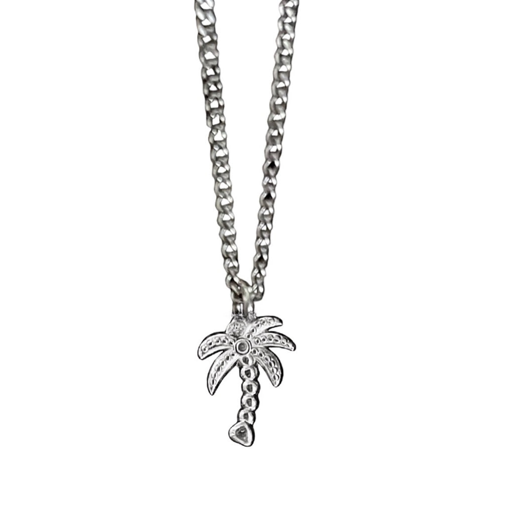Silver palm tree pendant necklace on a white background