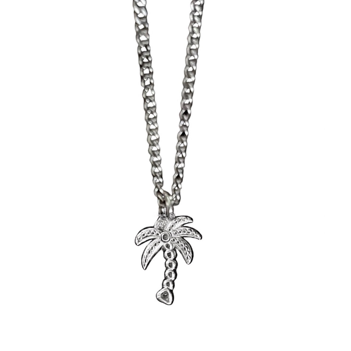 Silver palm tree pendant necklace on a white background